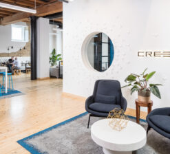 The entry / lobby area of the Creed Interactive office space including a small seating area with two chairs.