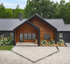 Front exterior view of the full Lakeside Retreat including a garage connected to the right side of the home, surrounded by trees