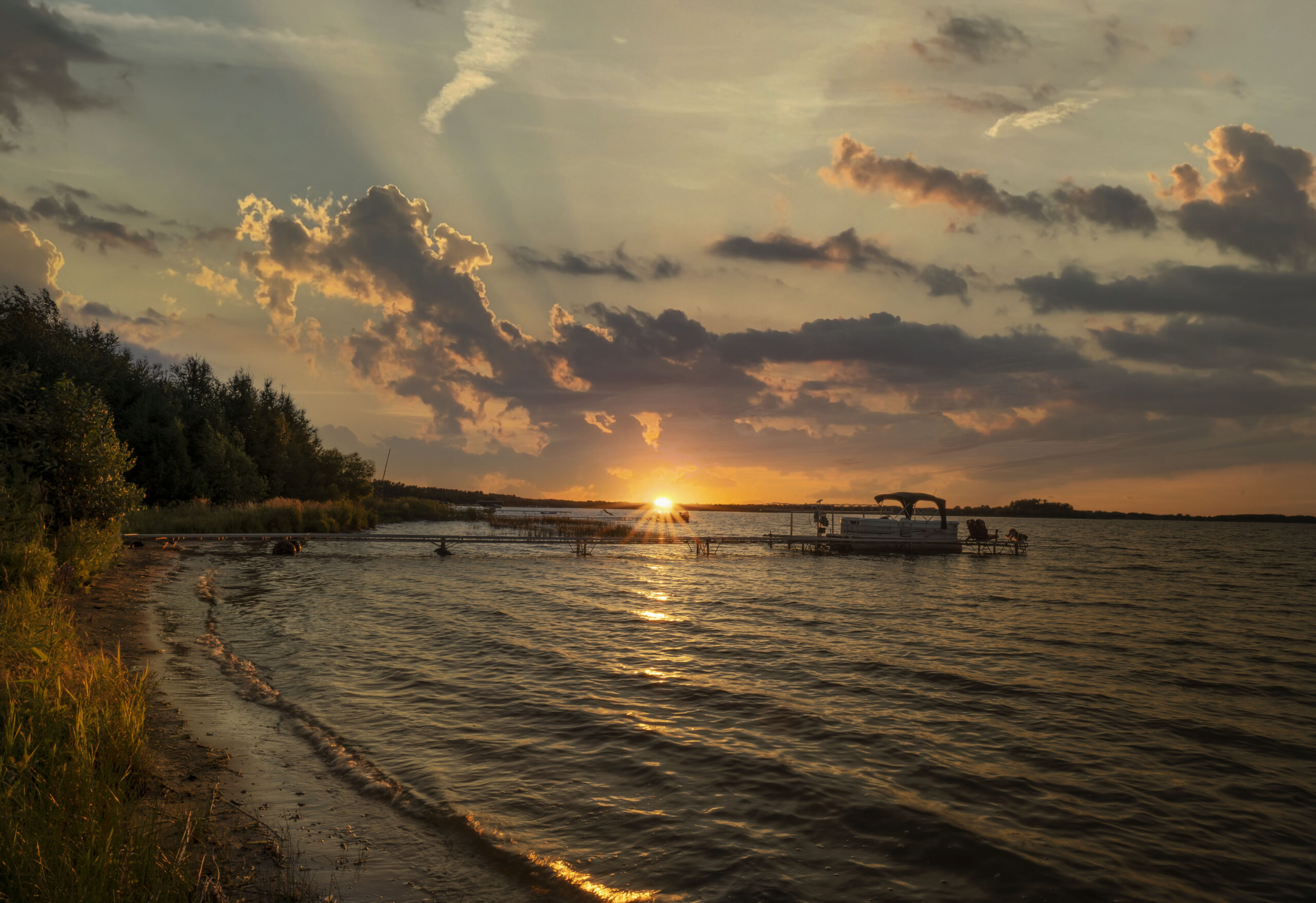 Shell Lake at sunset, the view adjacent to the Shell Lake Cabin home.