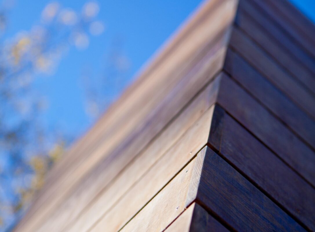 Close-up detail shot of the wood siding on the exterior of the renovated home
