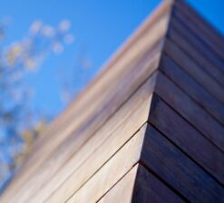 Close-up detail shot of the wood siding on the exterior of the renovated home