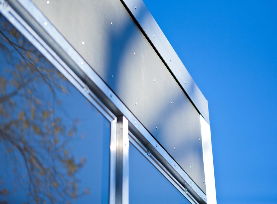 Close-up detail of the aluminum siding on the exterior of the renovated home