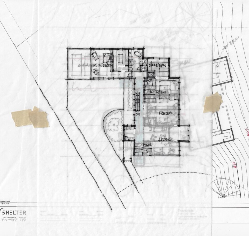 A house floor plan sketch on parchment paper taped on top of a copy of the site plan.