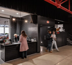 Audience members ordering at the concession stand at the HUGE Improv Theater during intermission.