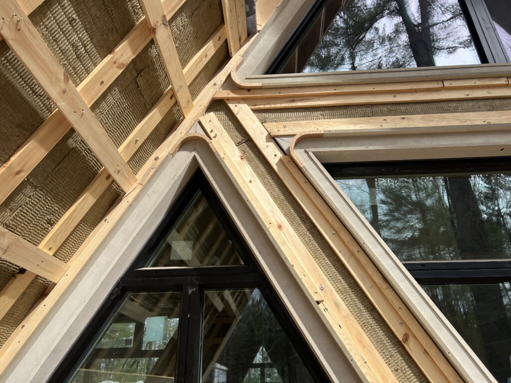 The exterior of a home under construction showing the thermal, water, and air control layers. 