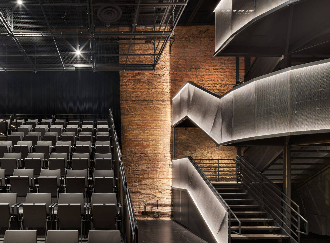 The theater seating and illuminated main staircase in the Luminary Arts Center performance space in Minneapolis, MN.