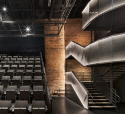 The theater seating and illuminated main staircase in the Luminary Arts Center performance space in Minneapolis, MN.
